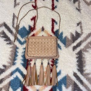 Women’s small light brown purse with gold accents